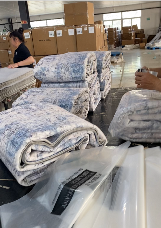 Folded washable rugs packed for factory shipping