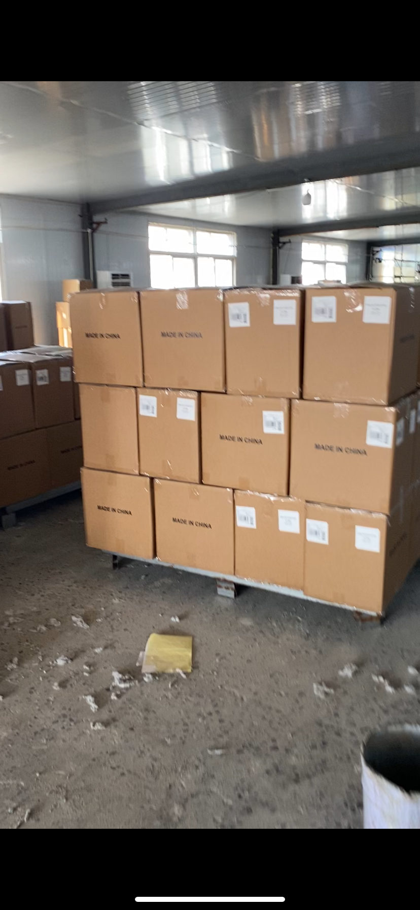 Private label rug export cartons in factory warehouse