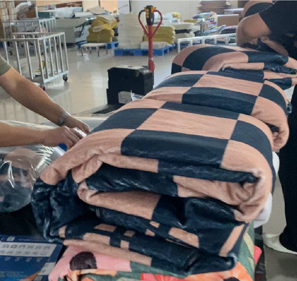 Folded faux-sisal washable rugs in factory packing