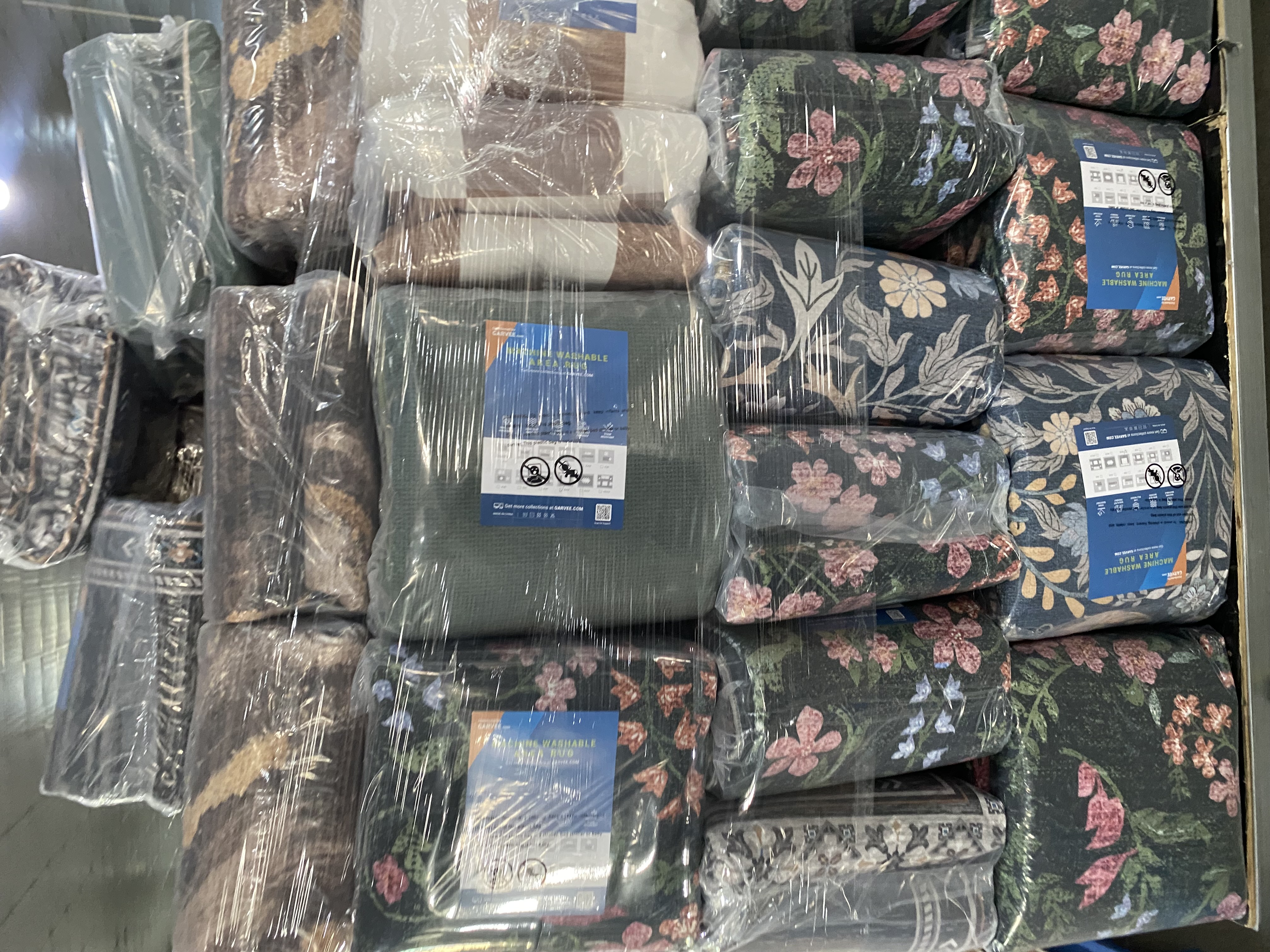 Packed floral washable rugs ready for project supply