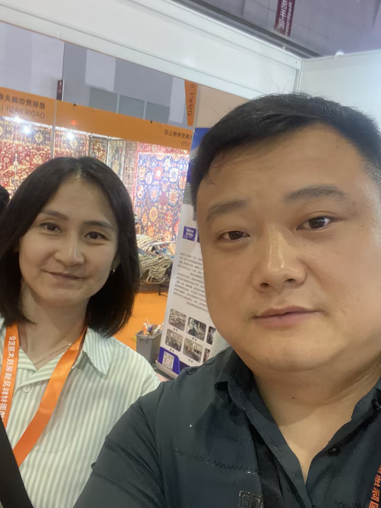 Overseas buyer meeting at a carpet trade show booth